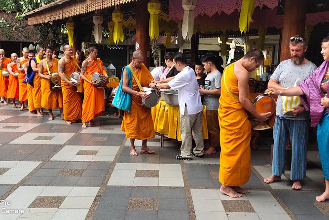 4 highlights: Sticky Waterfall/Elephants/local market /Wat Banden - Sticky Waterfall: walking in the falls and “massage bathing”