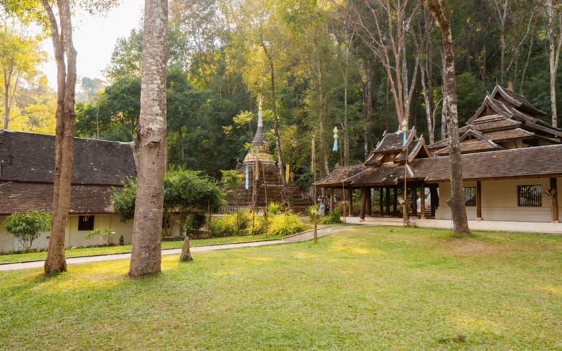 Chiang Mai: Doi Suthep Temple and Waterfall by Songtaew Trio - Stop 2: Wat Pha Lat, the sloping-rock monastery in the forest (about 40 minutes)