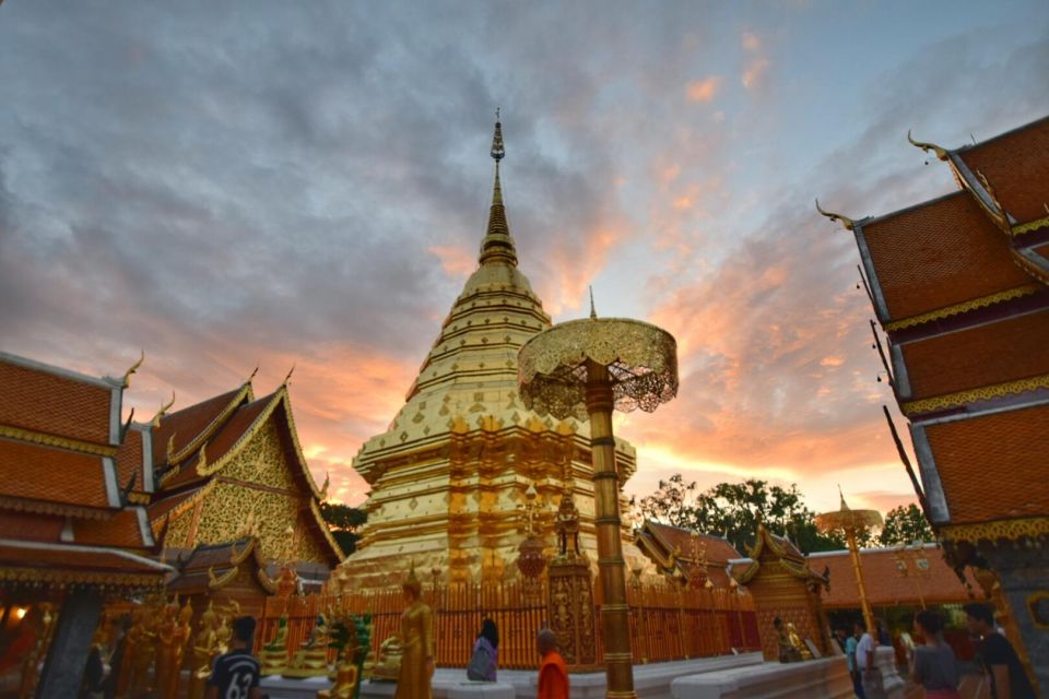 Chiang Mai: Doi Suthep & Wat Umong Twilight Tour with Pickup - Wat Phra That Doi Suthep at night: gold glow and the Naga staircase