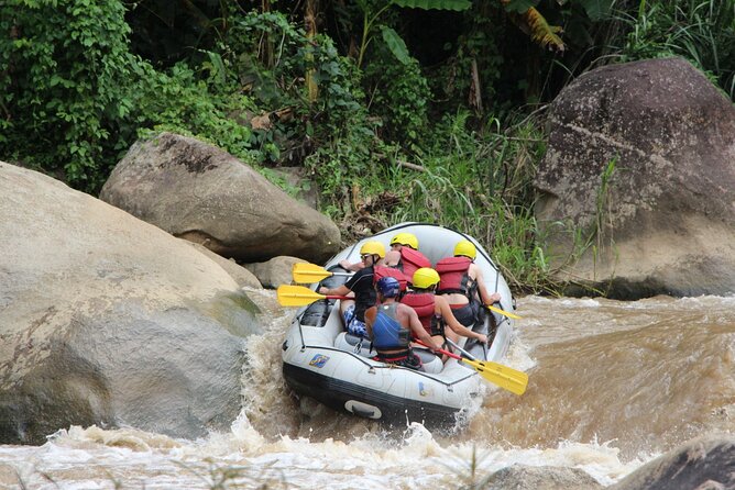 Chiang Mai Rafting in Mae Taeng River with Thai Buffet - Waterfall time: slide fun, quick lessons, and a rough climb