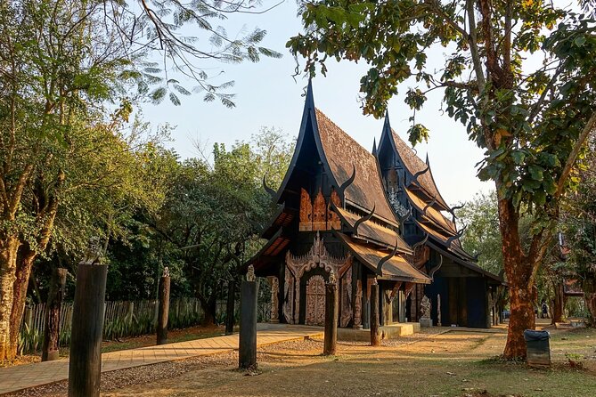 Chiang Rai Famed Temples and Golden Triangle Tour from Chiang Mai - Wat Rong Khun (White Temple): Shiny Glass Meets Big Tourist Energy