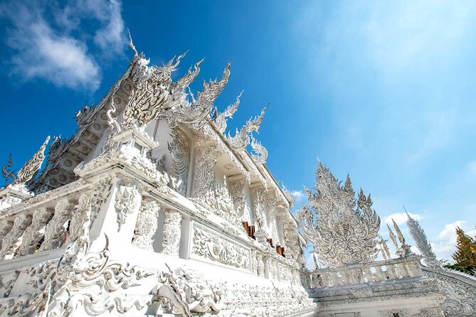Golden Triangle, White, Black, Blue Temple Full Day Tour From Chiang Mai - Wat Rong Suea Ten (Blue Temple): modern carvings in a sea of blue