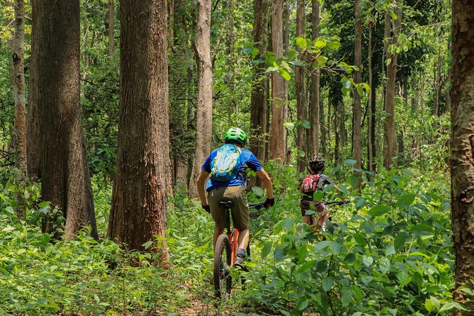Sticky Waterfall Cycling Tour - Getting to the trailhead: longtail boat across Mae Kuang